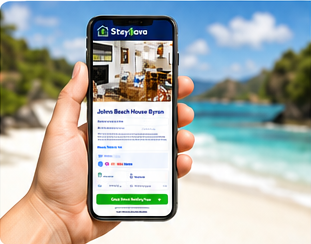 Hand holding a phone showing the Stay Sava booking page, beach in background